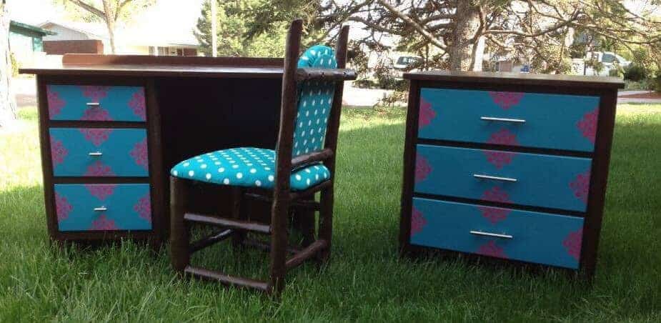 brown and teal desk, chair, and dresser