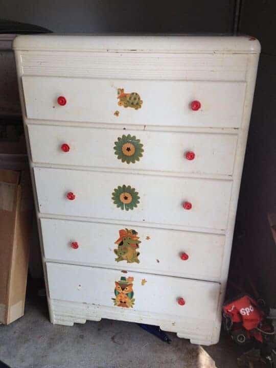 white dresser with red knobs