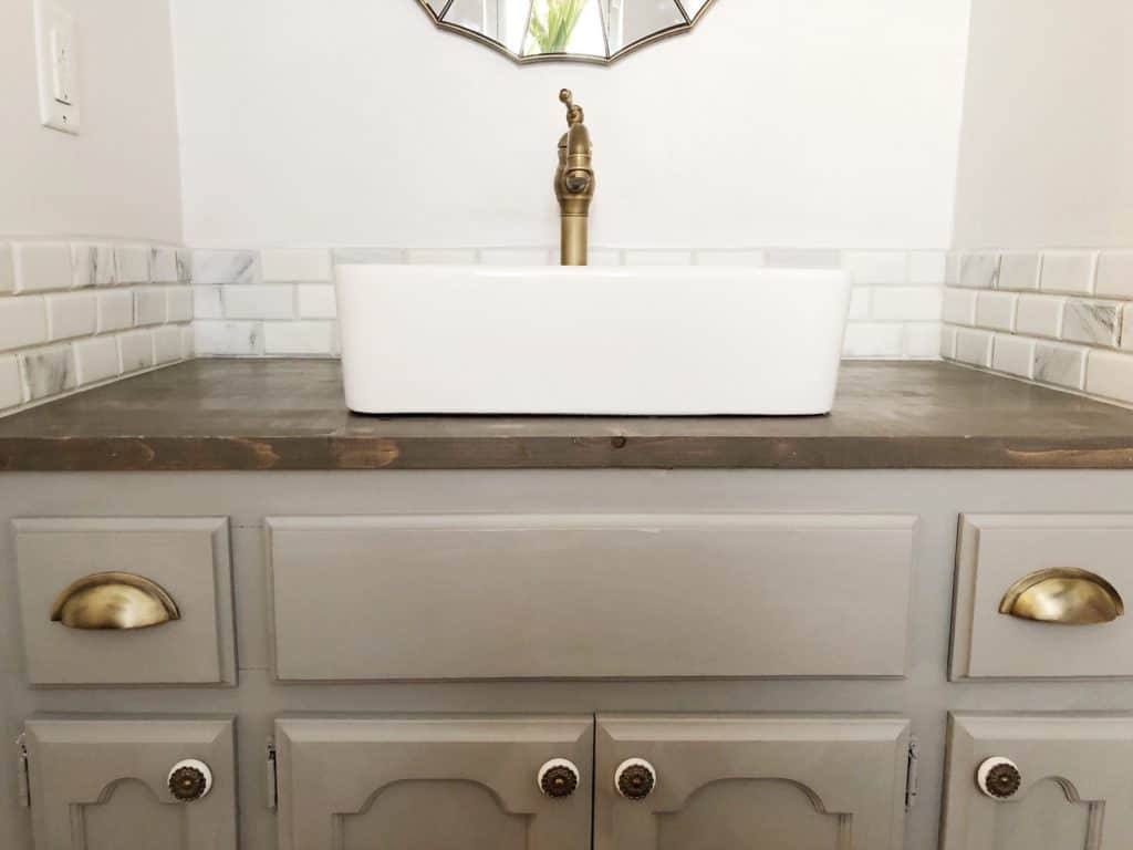 gray cabinets in half bath