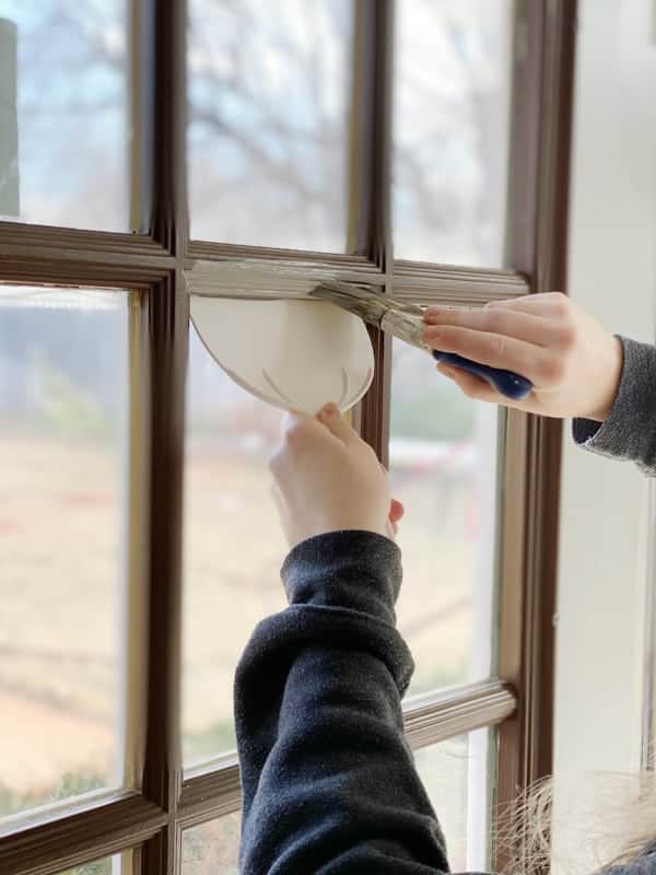 painting window trim using putty knife