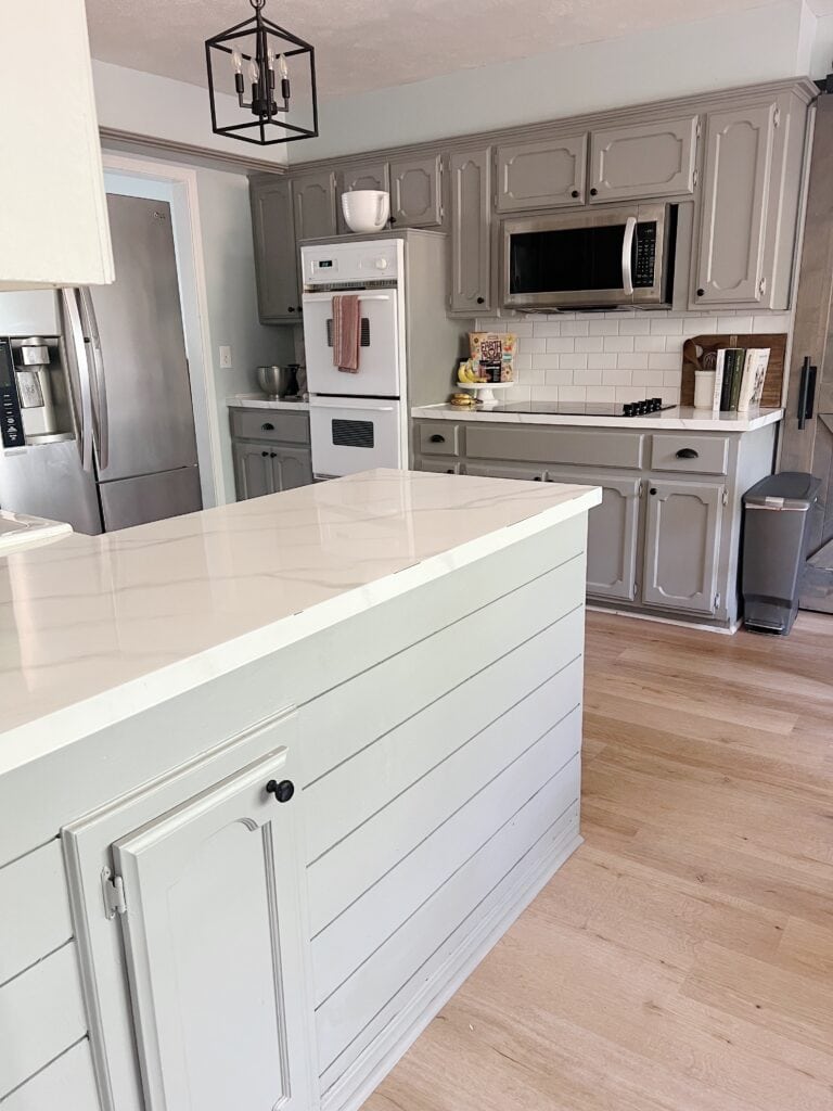 kitchen with gray cabinets and white countertops