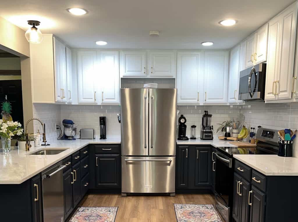 Navy blue lower and white upper kitchen cabinets