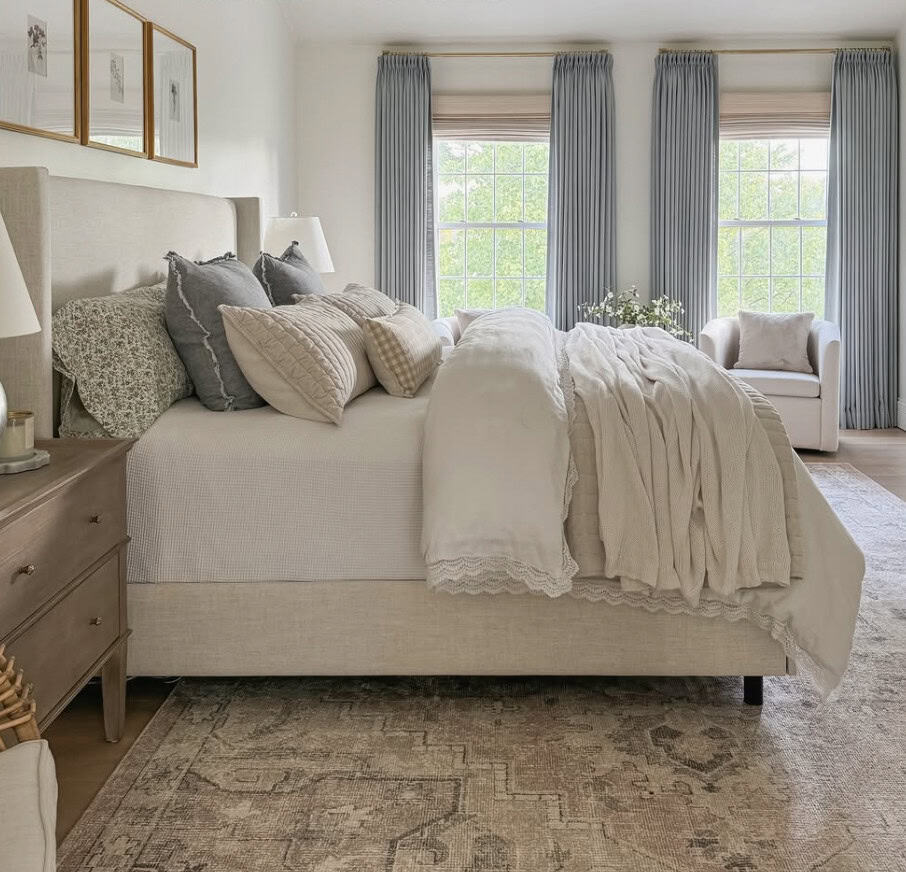 Beautiful neutral layered bedding by Blushing Boho.