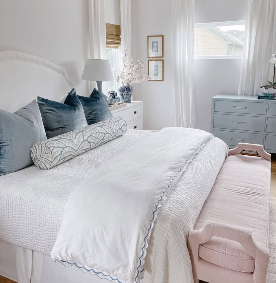 Blue velvet euro pillows on white bedding by Veronika Javor