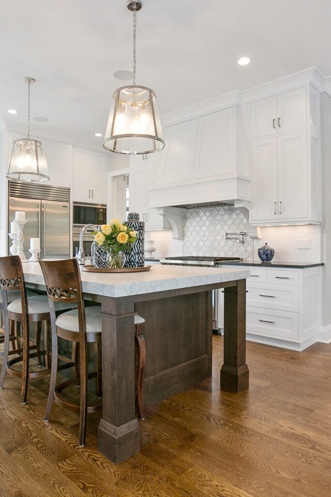 Traditional kitchen with medium hardwood flooring, offering a balanced, natural look that complements both light and dark cabinetry.