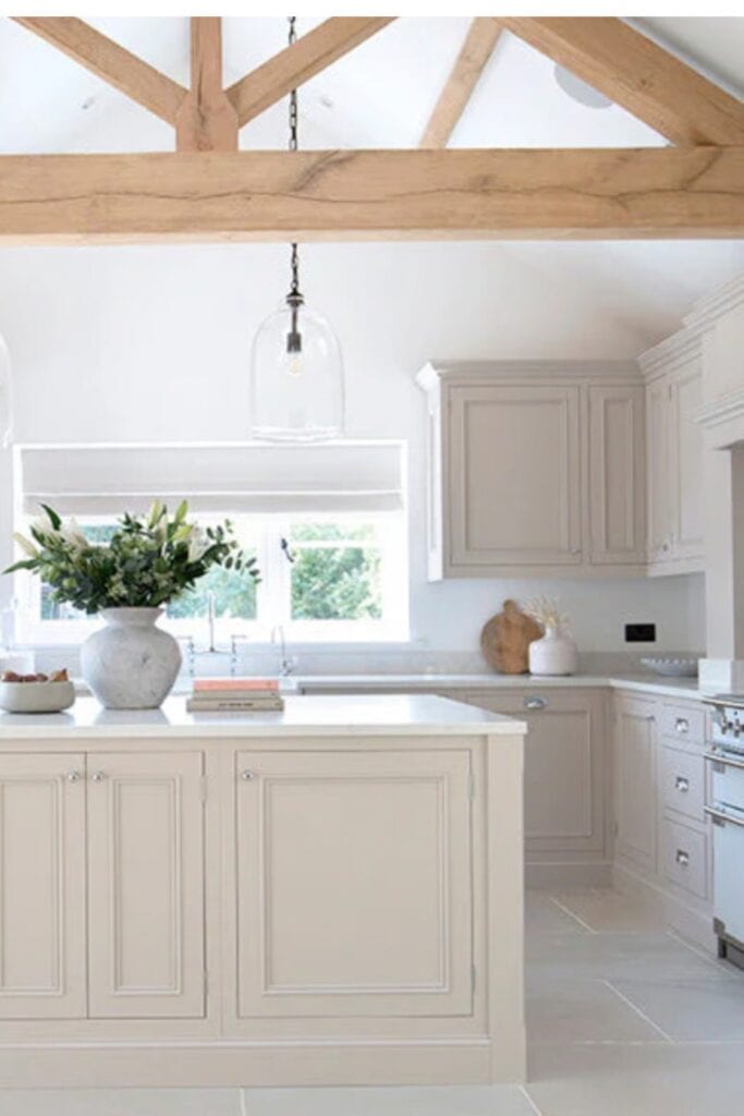 Light, airy kitchen with stone flooring.
