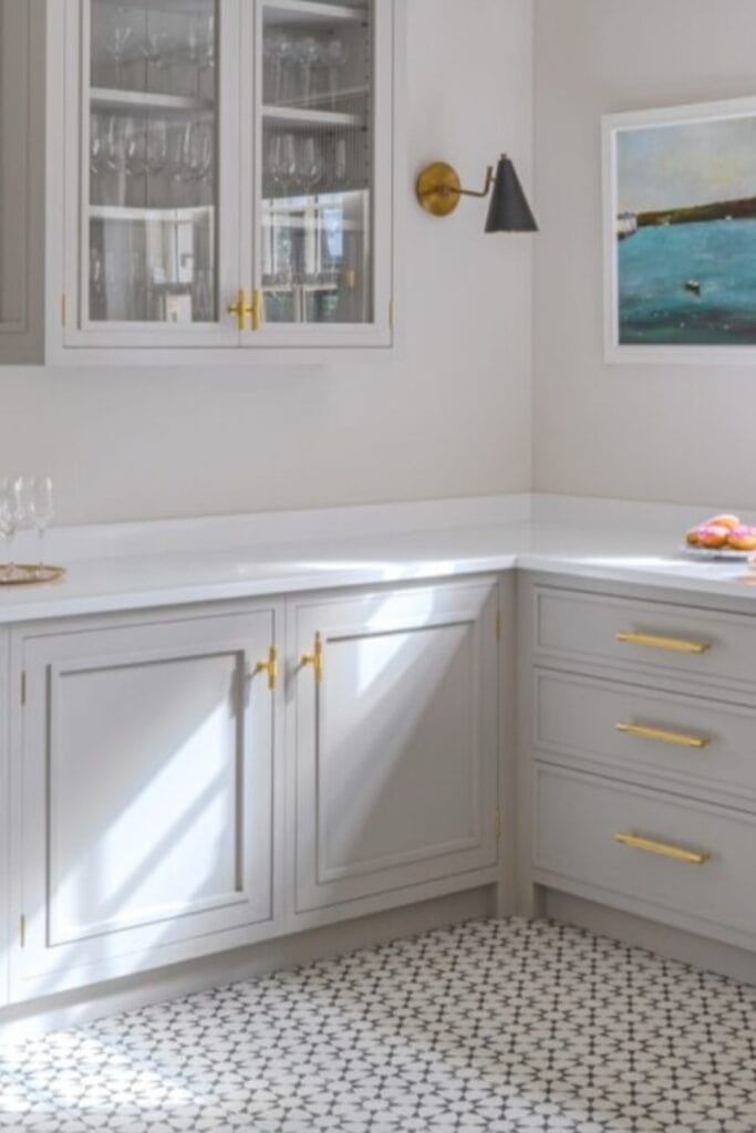 Kitchen with light patterned ceramic tile flooring.